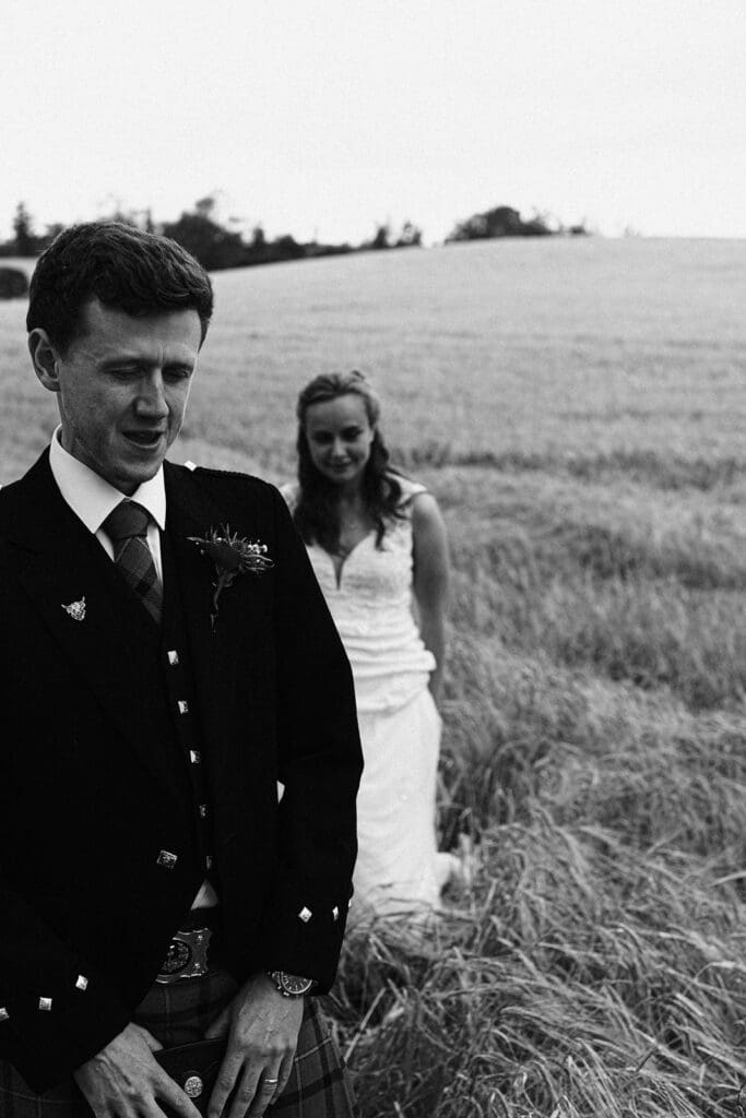 the bride and groom having their portraits taken in the grounds of enterkine country house in Ayrshire