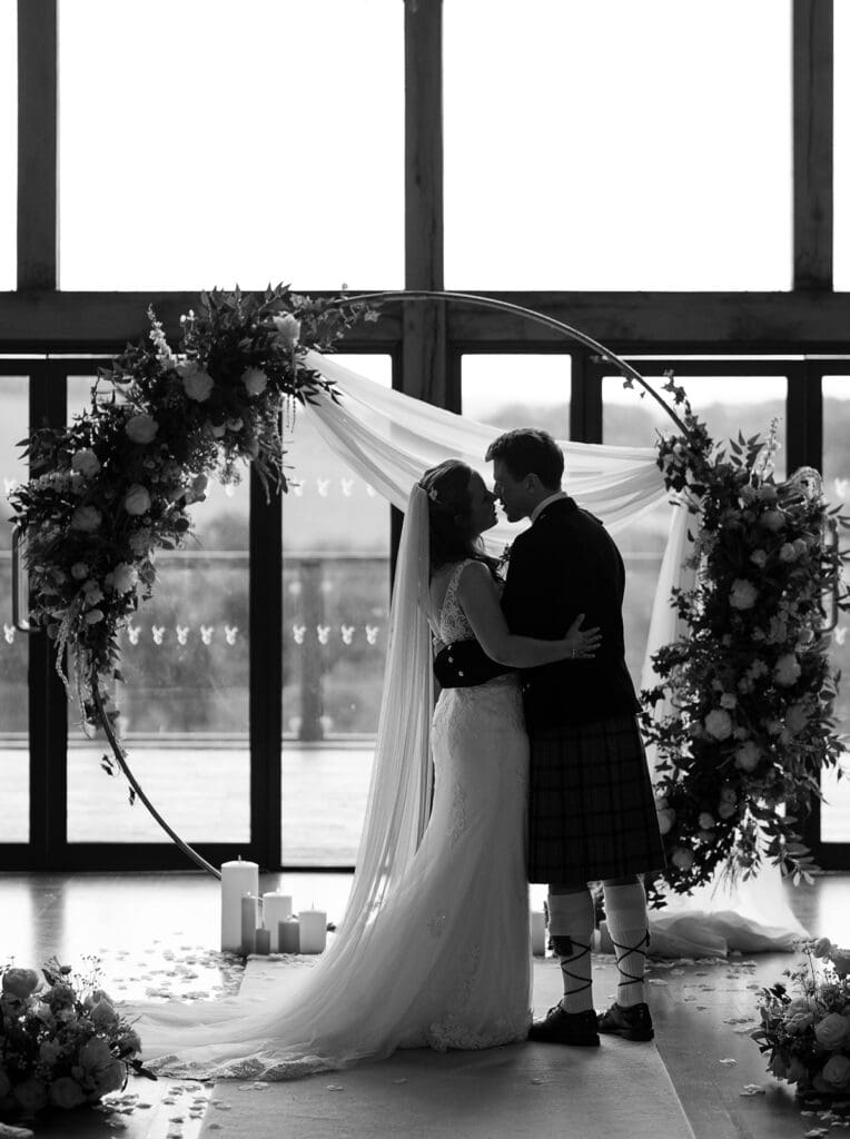 the first kiss after the ceremony at Enterkine country house in Ayrshire