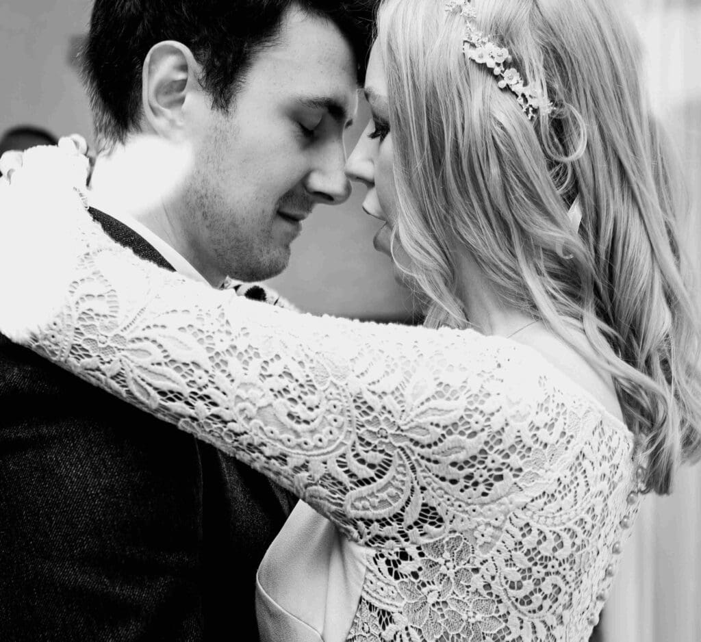 The bride and groom share a kiss during the first dance in Glasgow