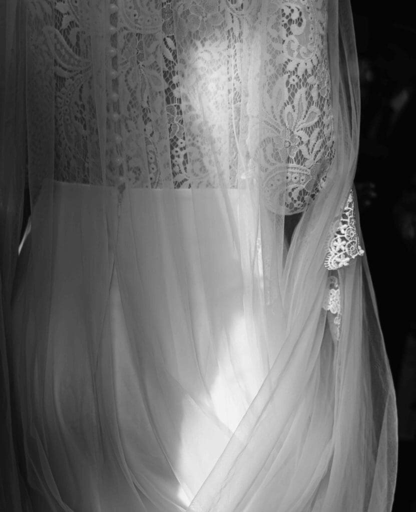 Sun illuminates the back of a brides dress as she enters the No.10 hotel in Glasgow