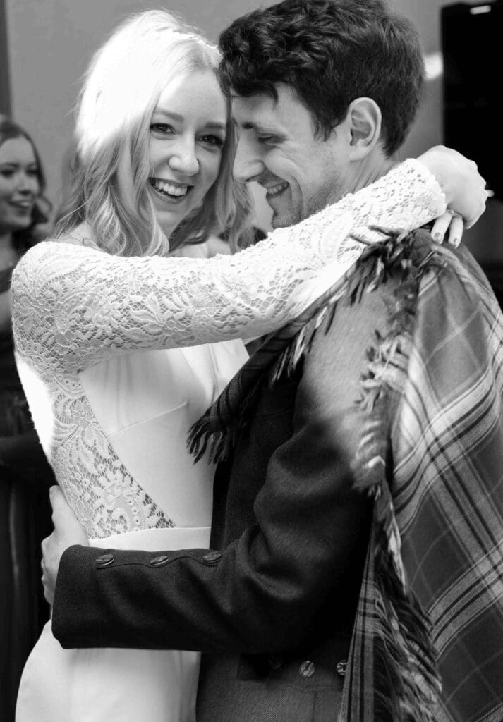 The bride and groom dancing