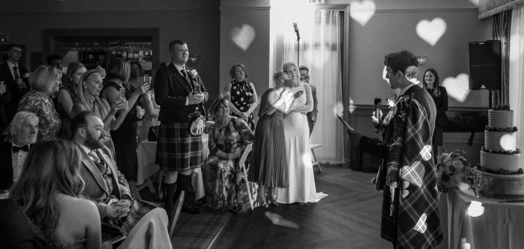 The groom gives a speech and toasts his bride in the reception venue at No.10 hotel