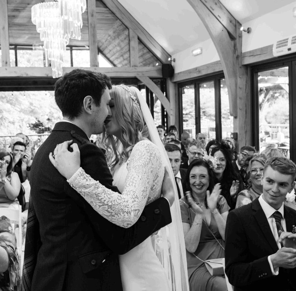 The bride and groom share a first kiss as they are married in the No.10 hotel, southside of Glasgow