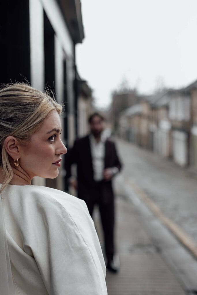 Edinburgh city centre bride and groom pose for fashion focused wedding portrait