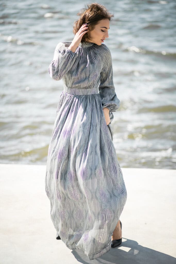 Guest at an Ayrshire wedding wearing a beautiful blue, fly away dress