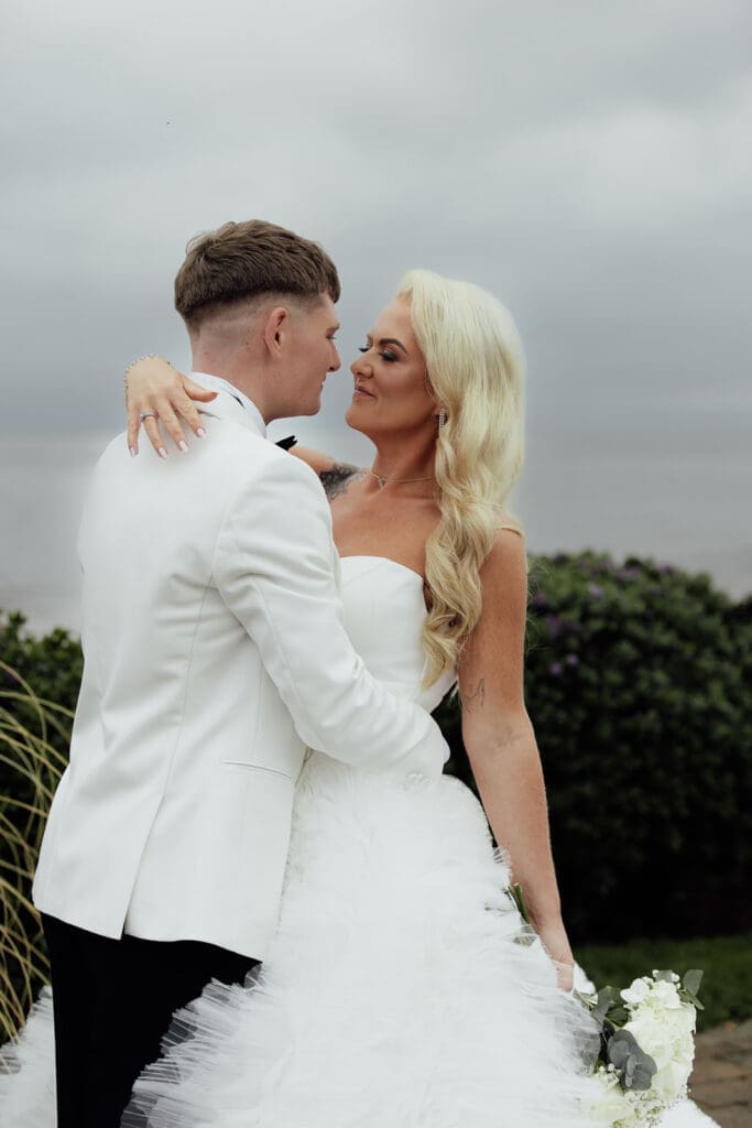 Bride and groom portraits at Seamill Hydro overlooking Arran