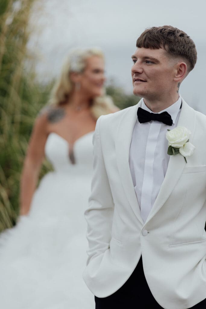 Bride and groom portraits at Seamill Hydro overlooking Arran