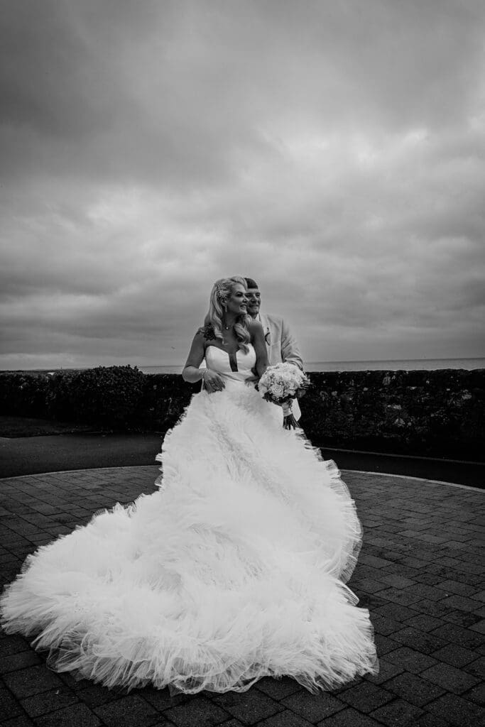 Bride and groom portraits at Seamill Hydro overlooking Arran